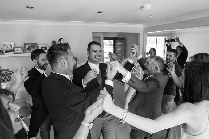 Groom-dances-at-the-house-with-his-family-befoere-the-ceremony