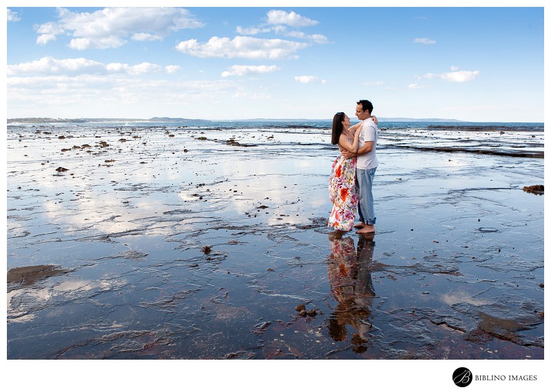 Engaged-couple-pose-while-portraits-are-taken-of-them-down-the-south-coast-of-NSW
