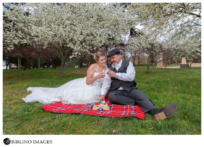 Bride and groom have a picnic during their wedding day Lennox gardens
